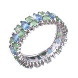 A natural blue and green stone eternity ring