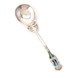 An Arts and Crafts silver and enamel spoon by William Hutton & Sons