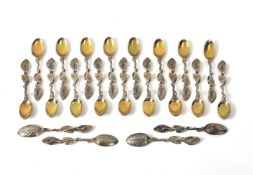 Twenty-one Victorian silver gilt cast tea spoons by Francis Higgins III