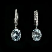 A pair of aquamarine and diamond earrings