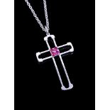 A ruby cross pendant