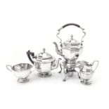 A late Victorian silver four piece octagonal tea service including a kettle on stand by Mappin and W