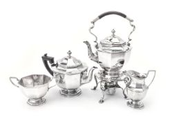 A late Victorian silver four piece octagonal tea service including a kettle on stand by Mappin and W