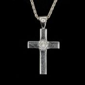 A diamond set cross pendant