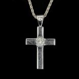 A diamond set cross pendant