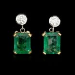 A pair of emerald and diamond earrings