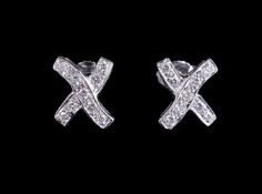 A pair of diamond cross earstuds