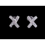 A pair of diamond cross earstuds