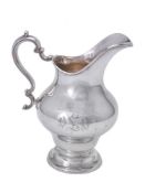 An American silver coloured ogee baluster water jug by Gorham Manufacturing Co.