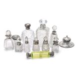 A collection of silver mounted items mainly scent or cologne bottles