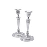 A matched pair of silver oval candlesticks by Fordham & Fordham