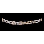 A cultured pearl and diamond bracelet by Mikimoto