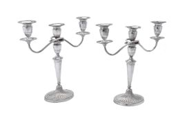A pair of electro-plated oval candelabra