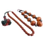 An amber coloured resin bead necklace