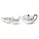 A silver circular three piece tea service by Mappin & Webb