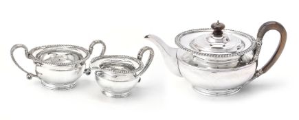 A silver circular three piece tea service by Mappin & Webb