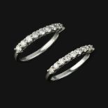 Two diamond half eternity rings