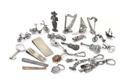 A collection of small silver coloured, white alloy and plated objects