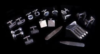 A collection of silver coloured cufflinks