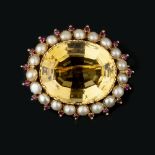 A mid Victorian citrine and half pearl brooch