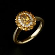 An 18 carat gold citrine and diamond cluster ring