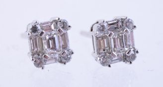 A pair of diamond set ear studs