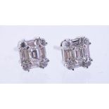 A pair of diamond set ear studs