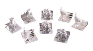 A set of eight silver menu or name card holders by Whitehill Silver & Plate Co.