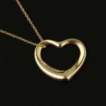 A gold coloured Open Heart necklace by Elsa Peretti for Tiffany & Co.