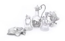 A pair of silver mounted clear glass noggins by Hukin & Heath Ltd