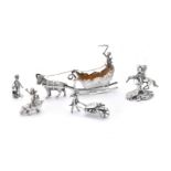 Five Continental silver toys with cherubs: driving a goat drawn sleigh