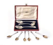 A suite of three berry spoons and a sifting spoon