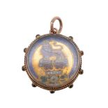 A late Victorian enamelled pendant