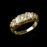 An 18 carat gold five stone diamond ring