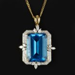 A blue topaz and diamond pendant