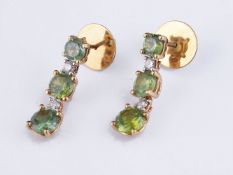 A pair of demantoid garnet and diamond earrings