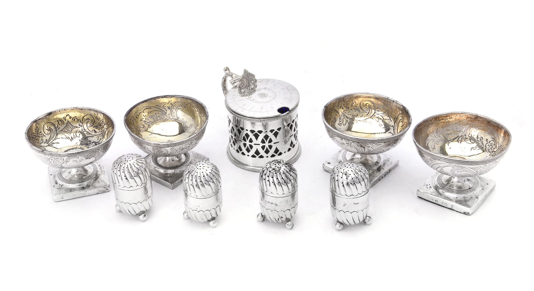 A set of four George III silver circular pedestal salt cellars by Peter