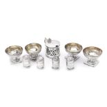 A set of four George III silver circular pedestal salt cellars by Peter