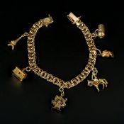 A gold coloured charm bracelet
