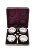 A set of four Victorian open salts with flower border and fluted rims