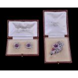 A pair of mid 20th century ruby and diamond flower head earrings and spray brooch