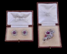 A pair of mid 20th century ruby and diamond flower head earrings and spray brooch