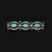 A turquoise and diamond brooch