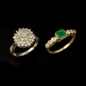 An emerald and diamond seven stone ring