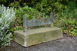 A substantial Victorian wrought iron and limestone mounted bootscrape