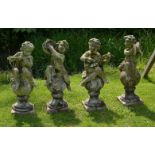 A set of four stone composition garden models of musical putti