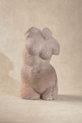 A sculpted terracotta model of a nude female torso