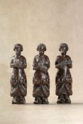 Three northern European carved term figures of musicians