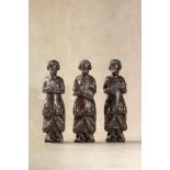 Three northern European carved term figures of musicians