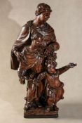 A Continental carved and stained walnut figural group,